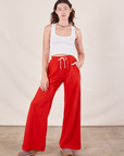 Alex is 5'8" and wearing P Wide Leg Sweat Pants in Mustang Red paired with a Cropped Tank in vintage tee off-white