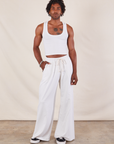 Jerrod is 6'3" and wearing S Wide Leg Sweat Pants in Vintage Tee Off-White paired with Cropped Tank