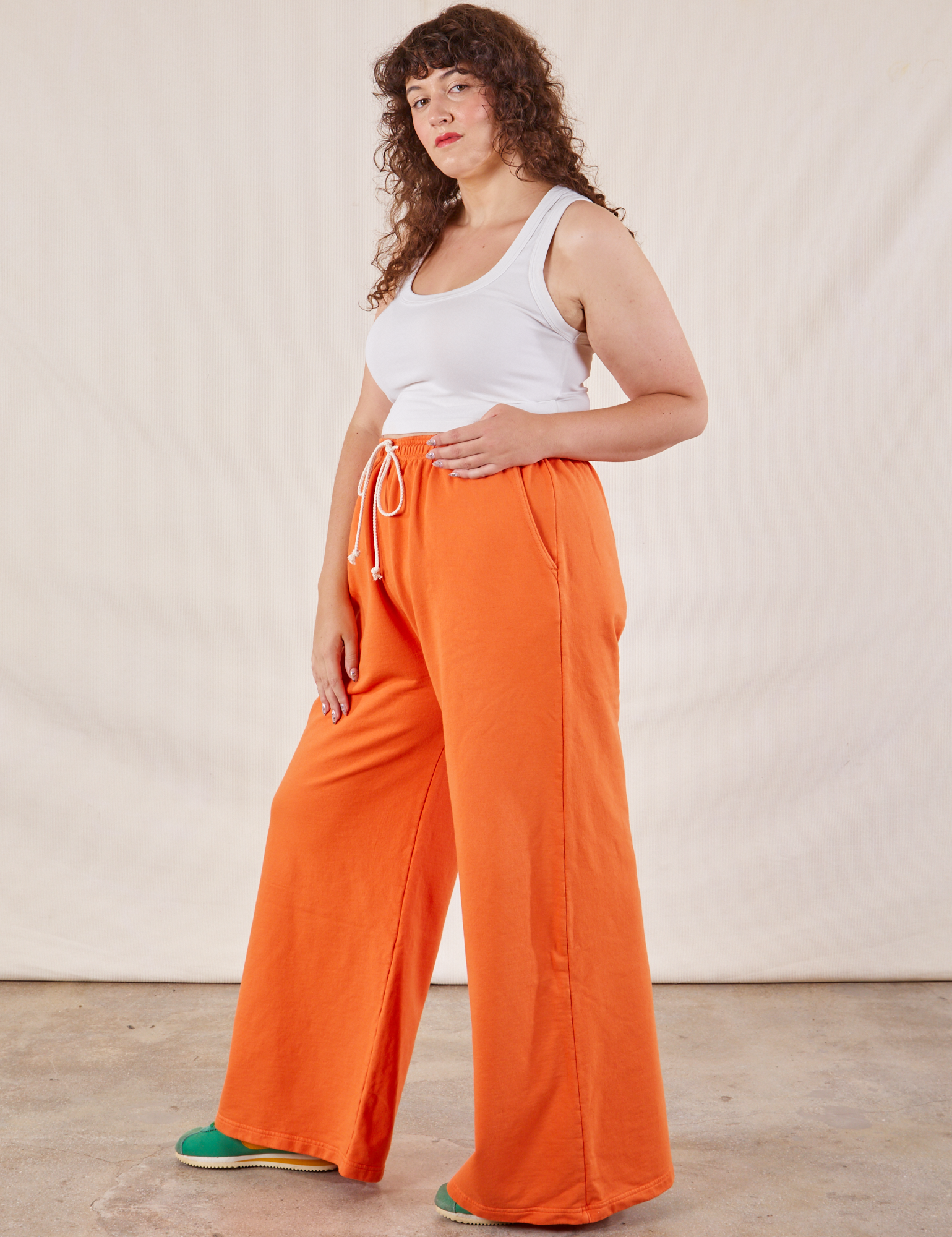 Wide Leg Sweat Pants in Sunset Orange side view on Ryan