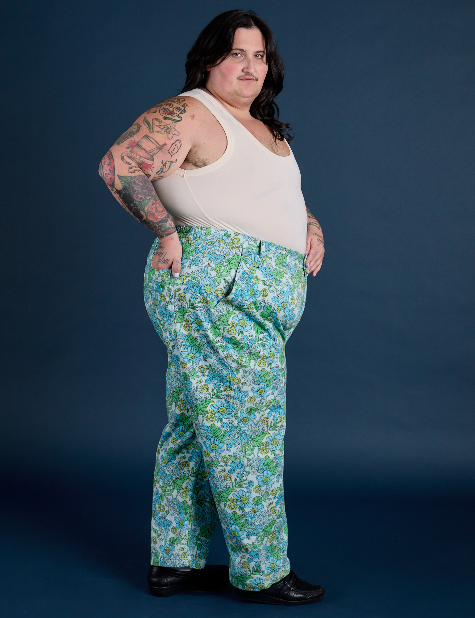 Side view of  Winter Floral Print Work Pants and Tank Top in Vintage Tee Off-White on Sam