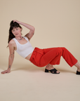 Work Pants in Mustang Red and Cropped Tank in Vintage Tee White worn by Alex