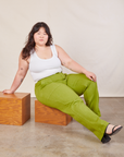 Ashley is wearing Work Pants in Gross Green and Cropped Tank in vintage tee off-white