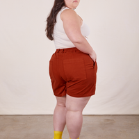 Angled back view of Classic Work Shorts in Paprika worn by Ashley
