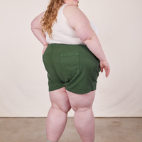 Back view of Classic Work Shorts in Dark Emerald Green on Catie