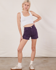 Madeline is wearing Classic Work Shorts in Nebula Purple and a Cropped Tank Top in vintage tee off-white