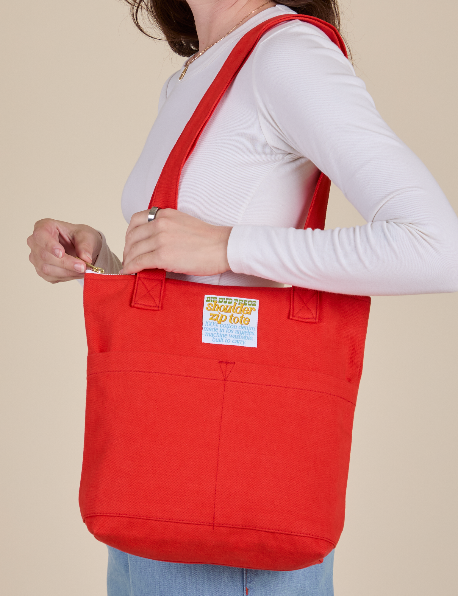 Over-Shoulder Zip Mini Tote in Mustang Red worn on shoulder of model