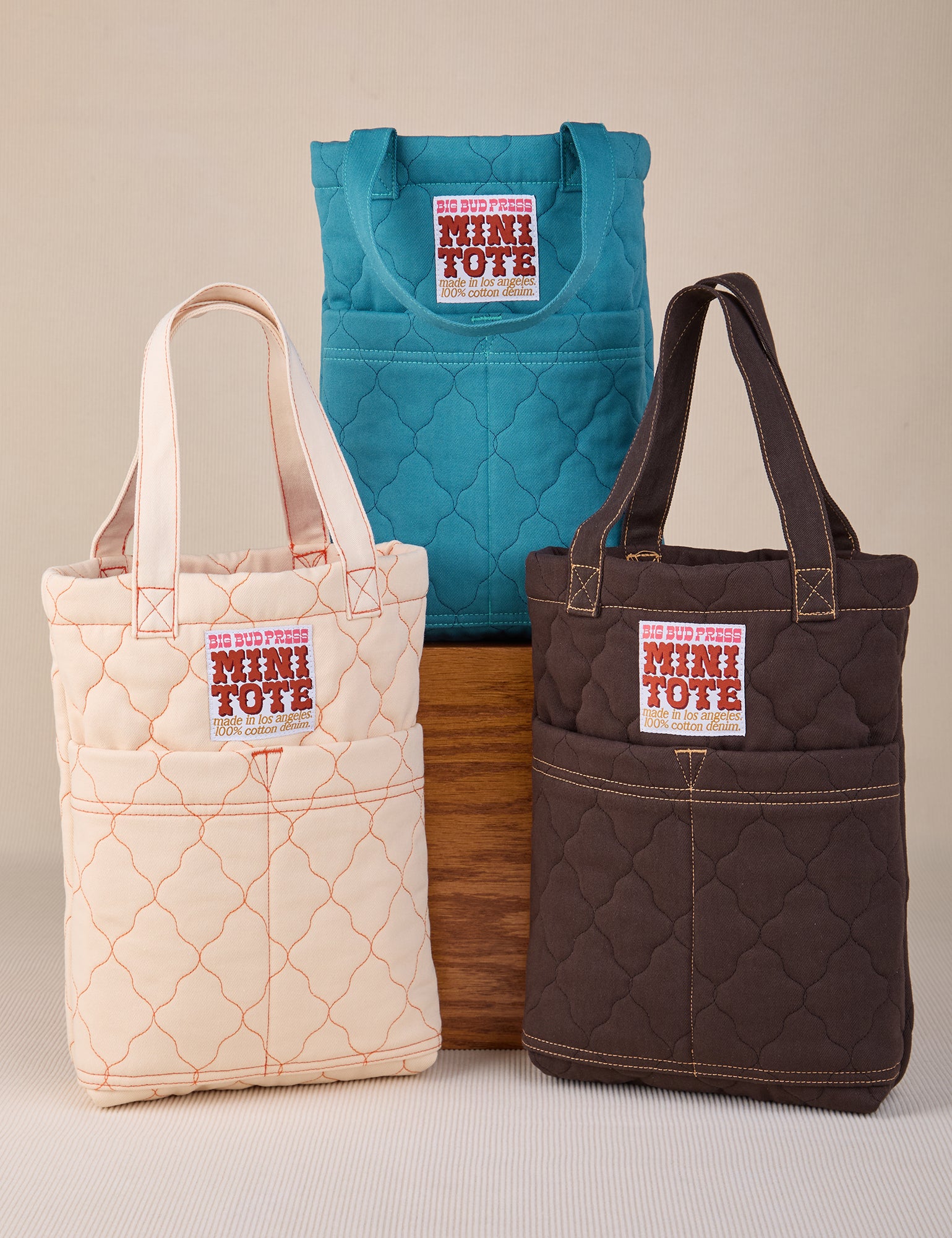 Quilted Mini Totes in marine blue, espresso brown and vintage tee off-white