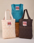 Quilted Mini Totes in marine blue, espresso brown and vintage tee off-white