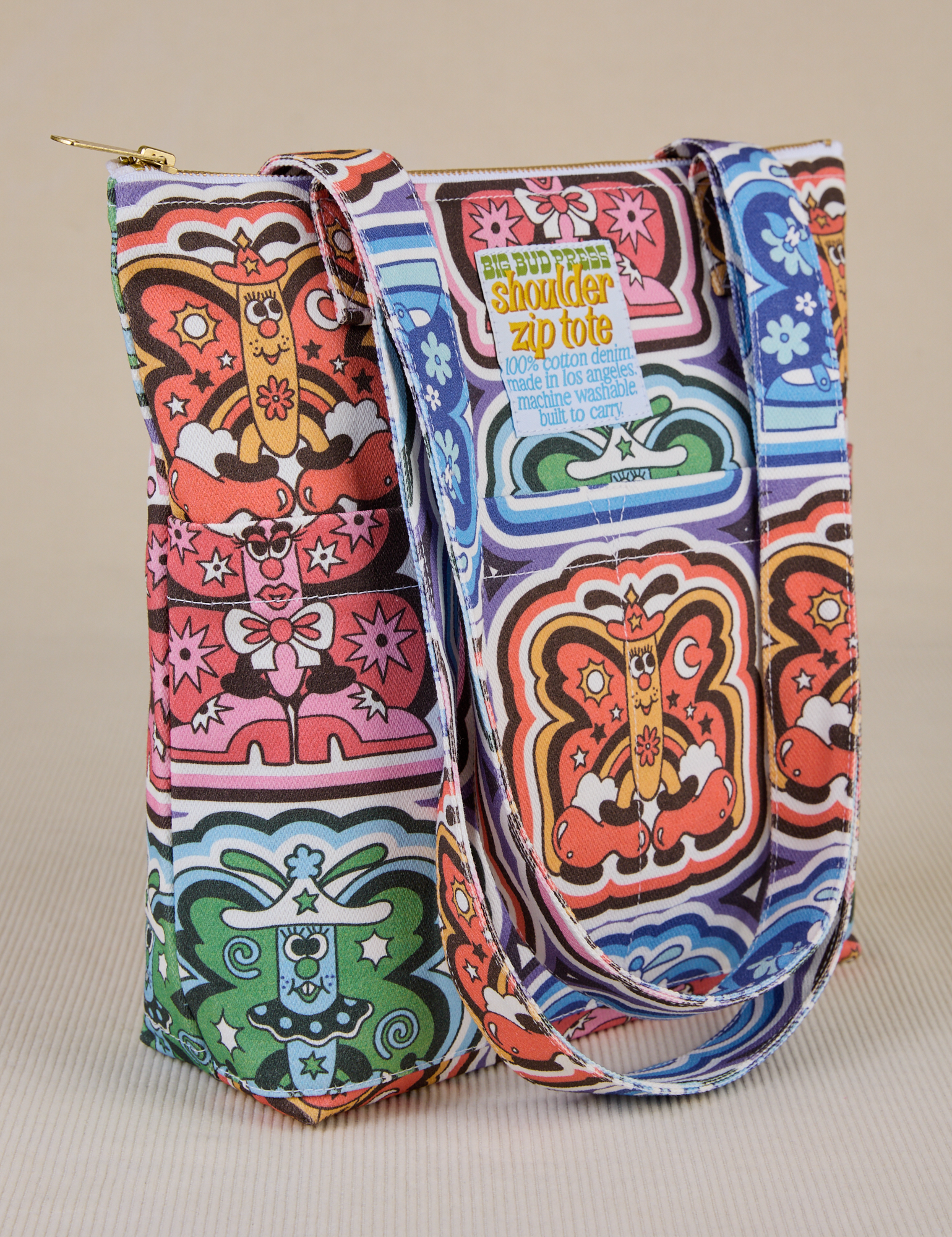 Angled view of Butterfly Kaleidoscope Shoulder Zip Tote