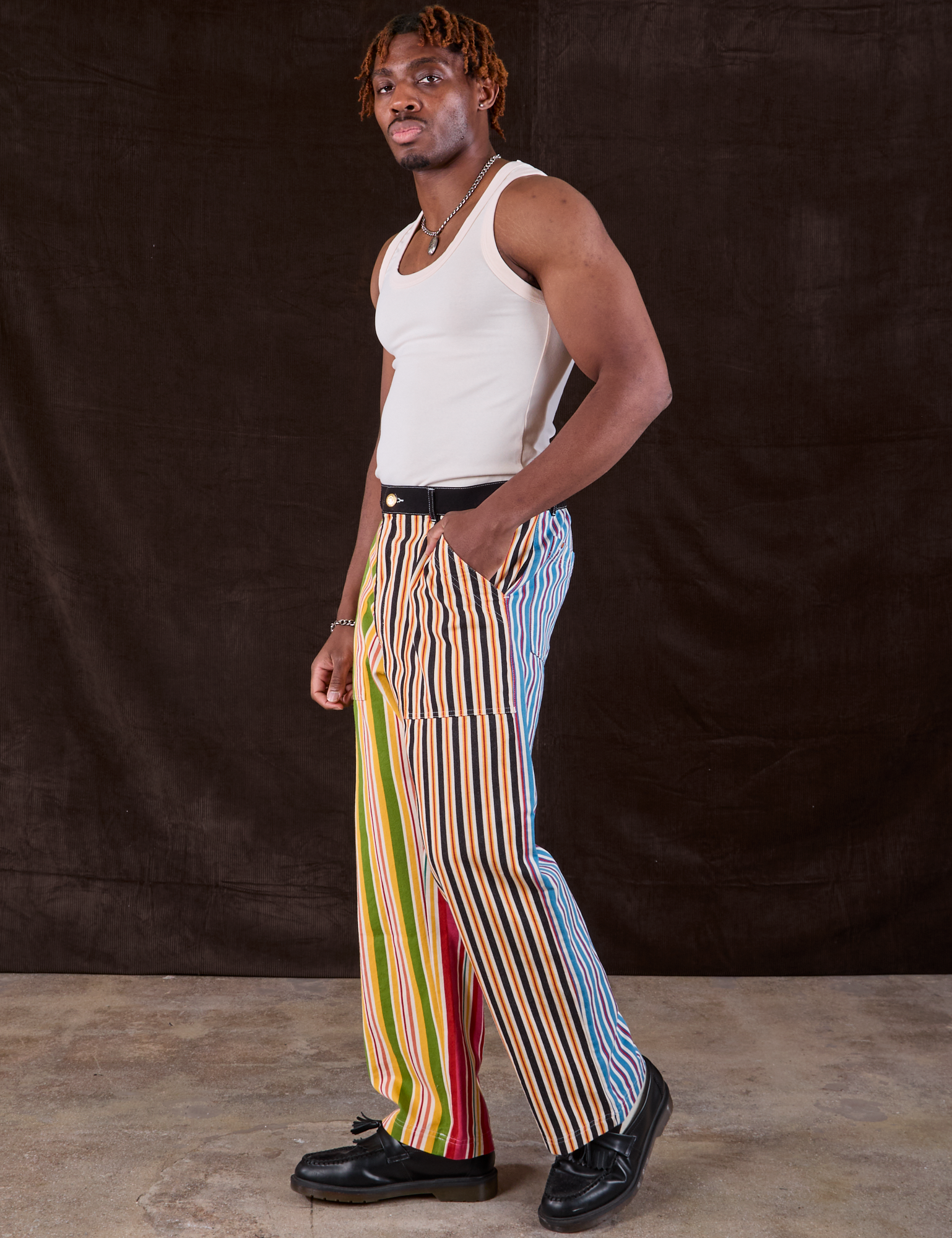 Side view of Mixed Stripe Work Pants and Tank Top in vintage tee off-white on Isaac