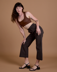 Work Pants in Espresso Brown and fudgesicle Mini Tank worn by Alex