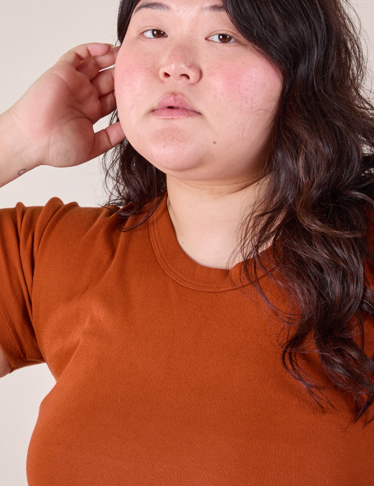 Baby Tee in Burnt Terracotta neckline close up on Ashley