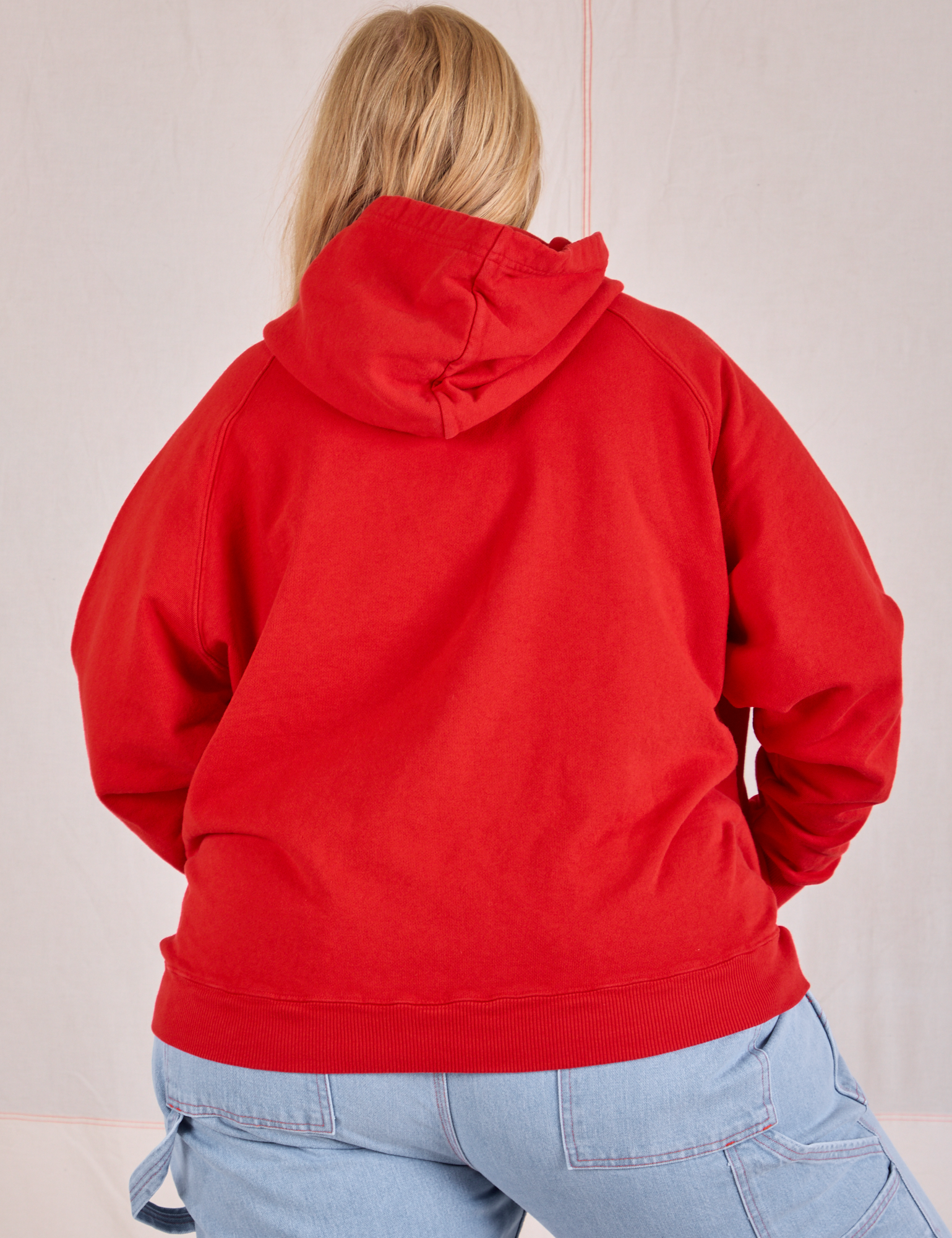 Collegiate Hoodie in Mustang Red back view on Juliet