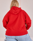 Collegiate Hoodie in Mustang Red back view on Juliet