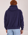 Collegiate Hoodie in Navy Blue back view on Issac