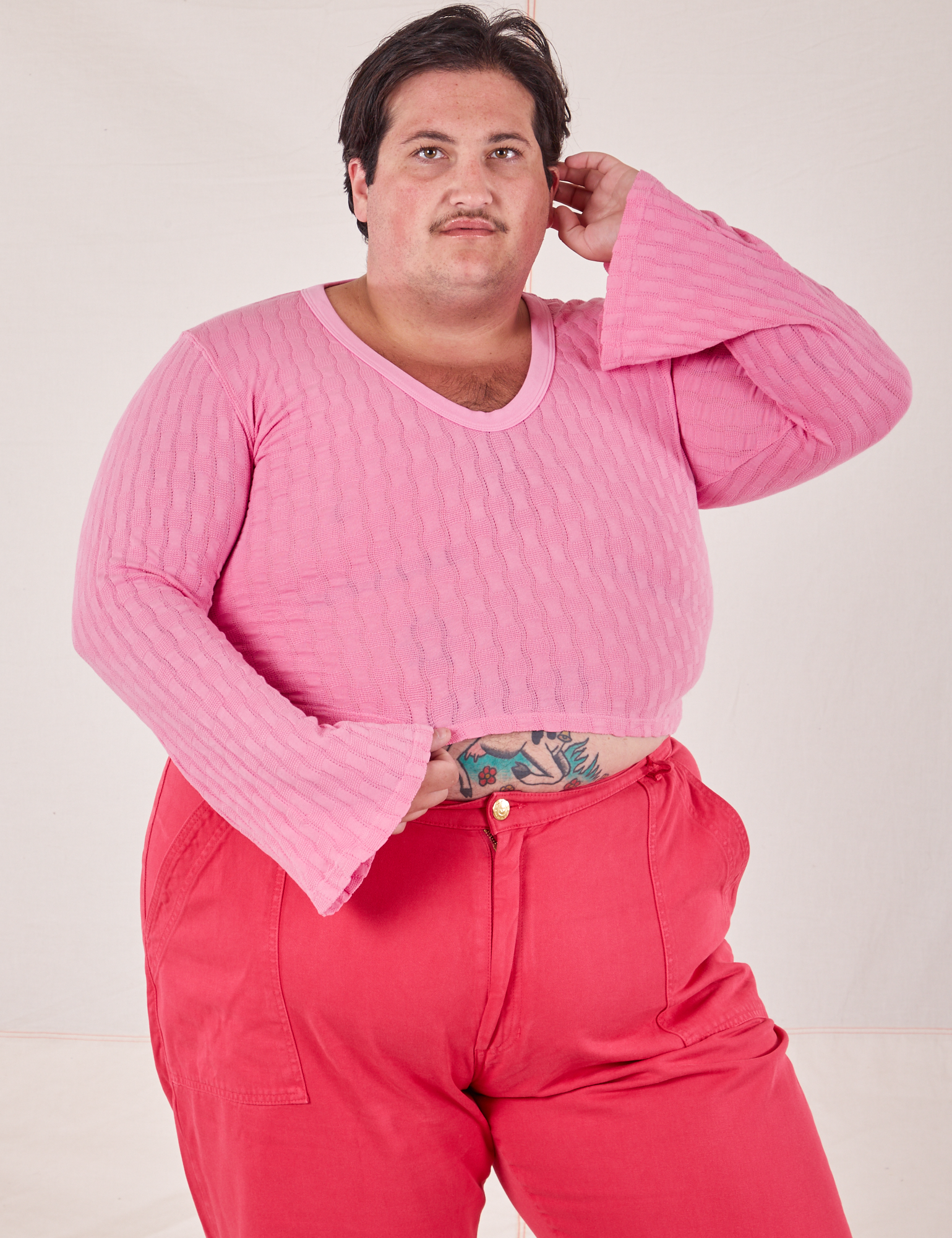 Sam is wearing 1XL Bell Sleeve Top in Bubblegum Pink and hot pink Work Pants