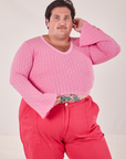 Sam is wearing 1XL Bell Sleeve Top in Bubblegum Pink and hot pink Work Pants