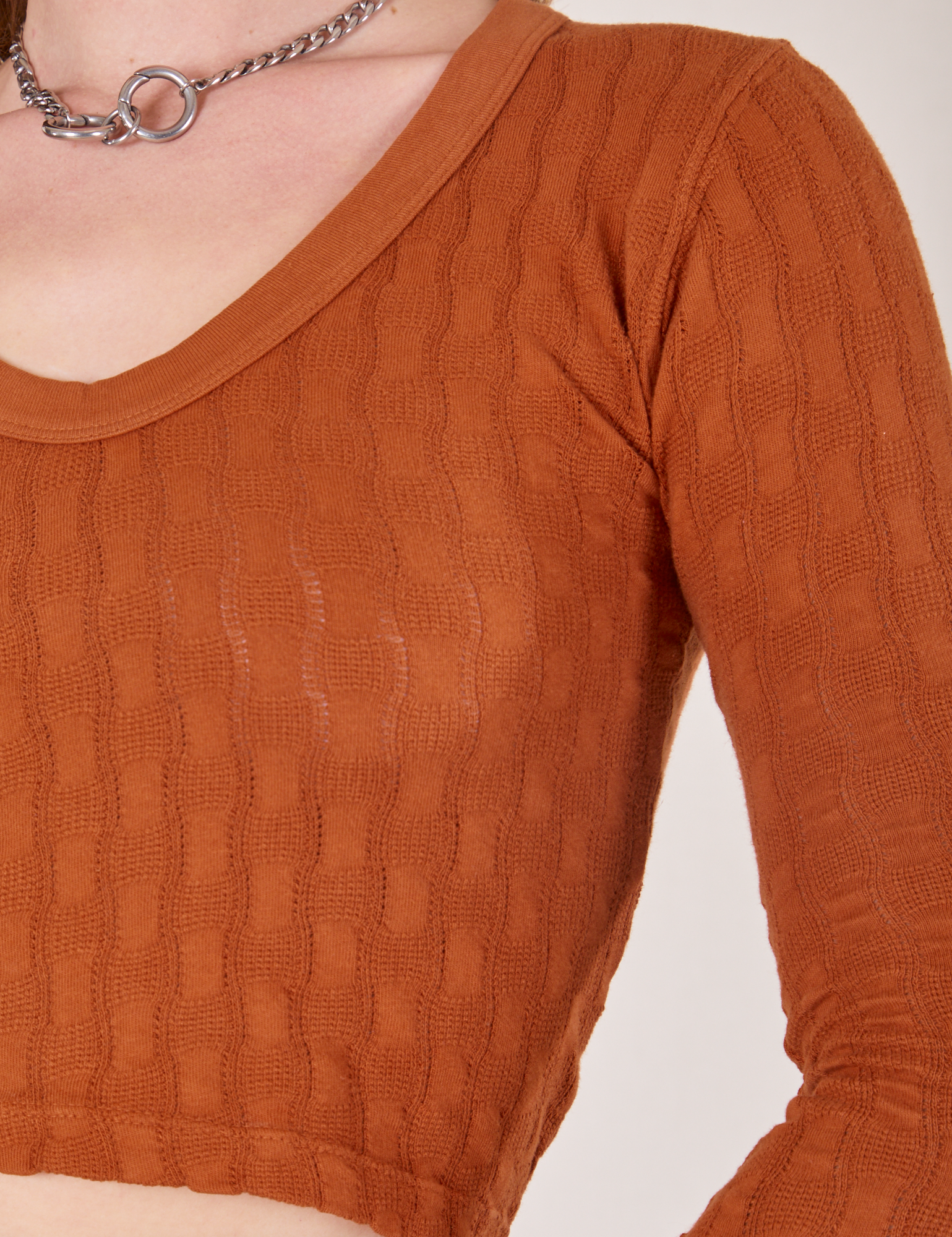 Front view of Bell Sleeve Top in Burnt Terracotta worn by Alex