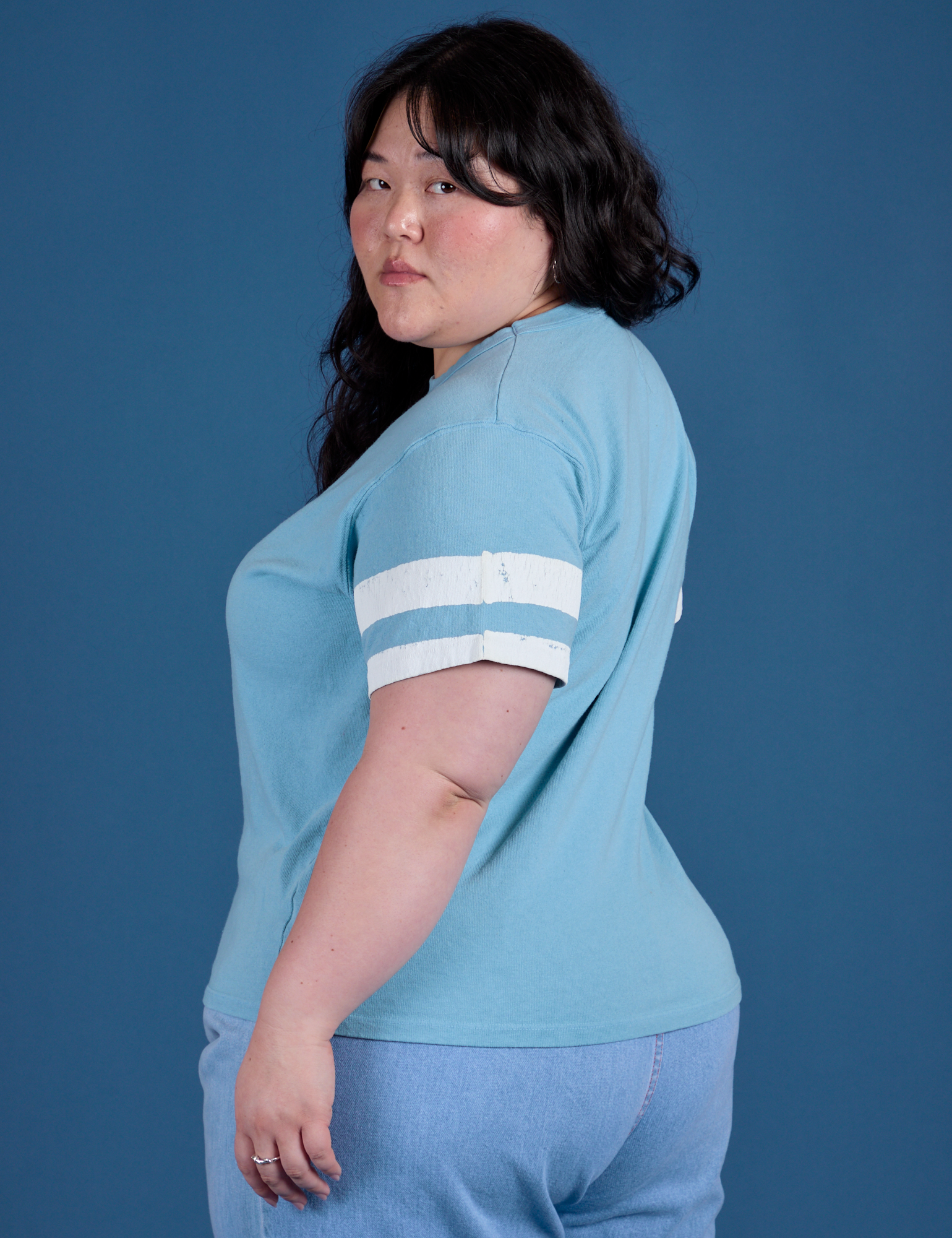 Painted Burly Tee in Baby Blue angled back view on Ashley