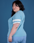 Painted Burly Tee in Baby Blue angled back view on Ashley
