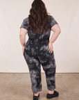 Back view of Petite Short Sleeve Jumpsuit in Black Magic Waters worn by Ashley
