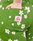 Bob Baker Flower Jumpsuit back pocket close up. Ashley has her hand in the pocket.