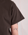 Burly Tee in Espresso Brown sleeve close up on Quinn