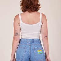 Back view of Cropped Cami in Vintage Off-White and light wash Frontier Jeans worn by Alex