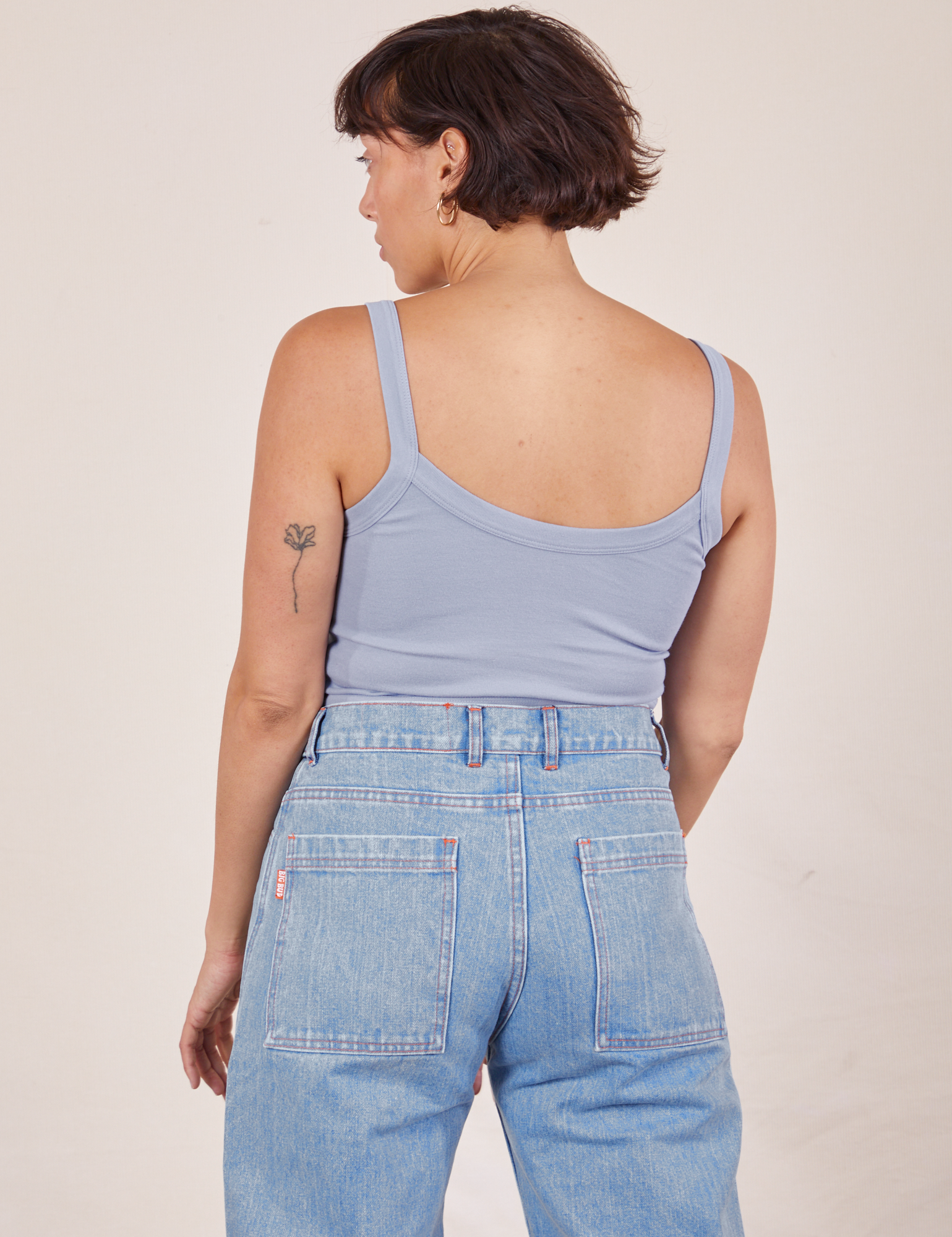 Back view of Cropped Cami in Periwinkle and light wash Sailor Jeans worn by Tiara