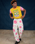 Isaac is wearing Vintage Tee in Bubblegum and Paintstamped Work Pants in bubblegum