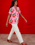 Kandia is waering Cherry Pantry Button-Up and Western Pants in vintage tee off-white