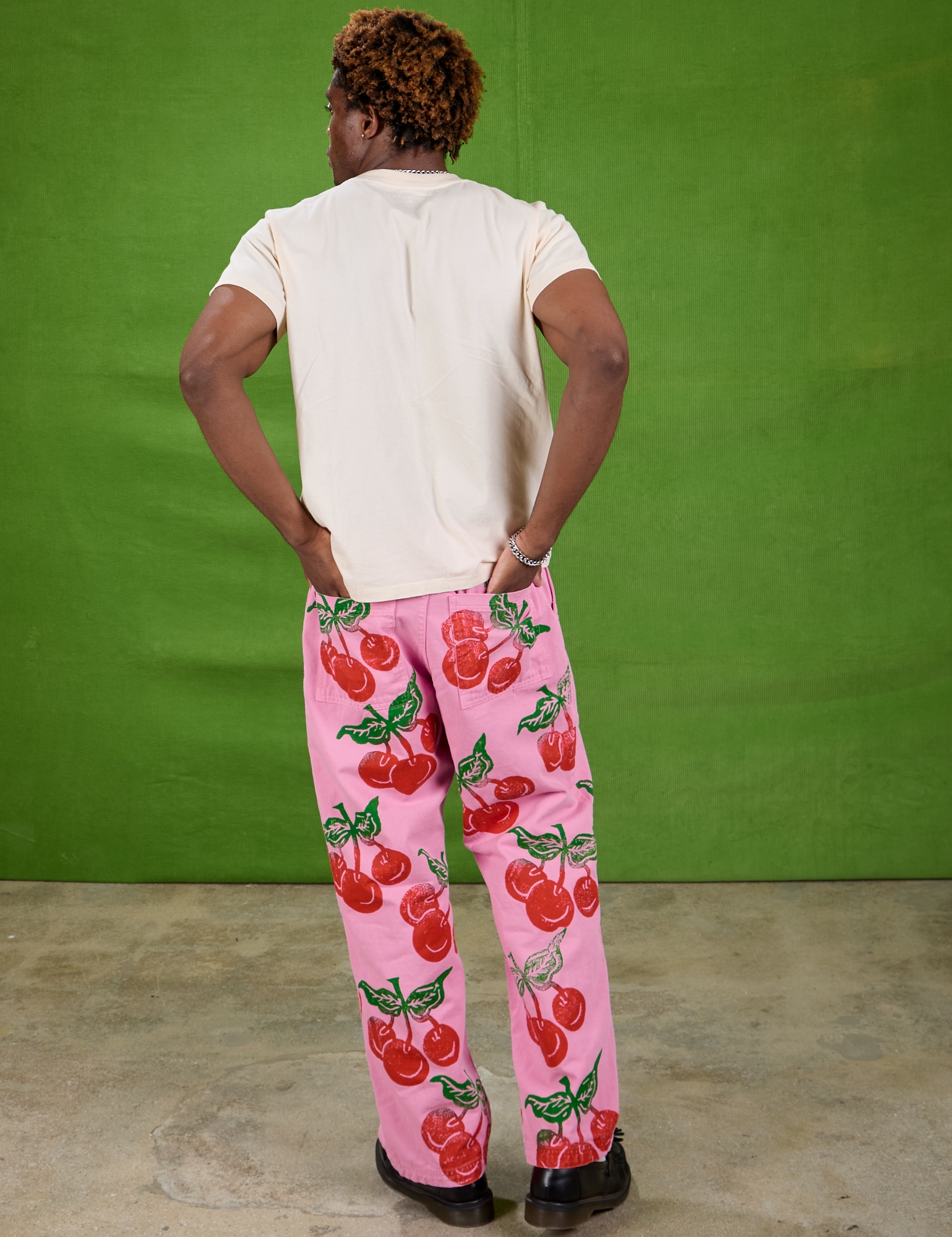 Back view of Cherry Paintstamped Work Pants in Bubblegum Pink and Organic Vintage Tee in Vintage Off-White