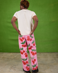 Back view of Cherry Paintstamped Work Pants in Bubblegum Pink and Organic Vintage Tee in Vintage Off-White