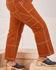 Carpenter Jeans in Burnt Terracotta side close up on Meghna