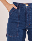 Carpenter Jeans in Dark Wash front pocket close up. Tiara has her hand in the pocket