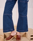Carpenter Overalls in Dark Wash pant leg close up on Alex