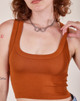 Front close up of Cropped Tank Top in Burnt Terracotta worn by Alex