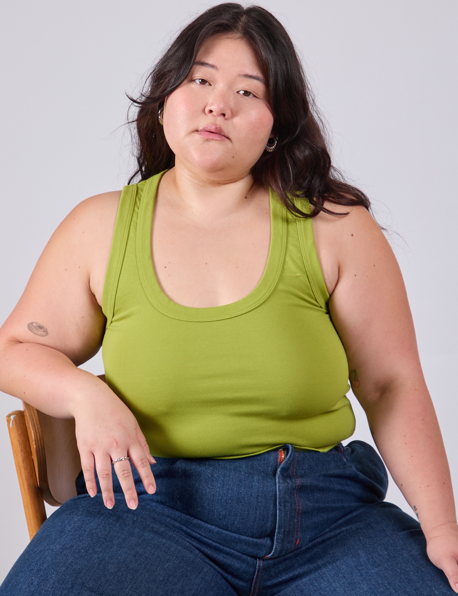 Ashley is wearing Cropped Tank Top in Gross Green