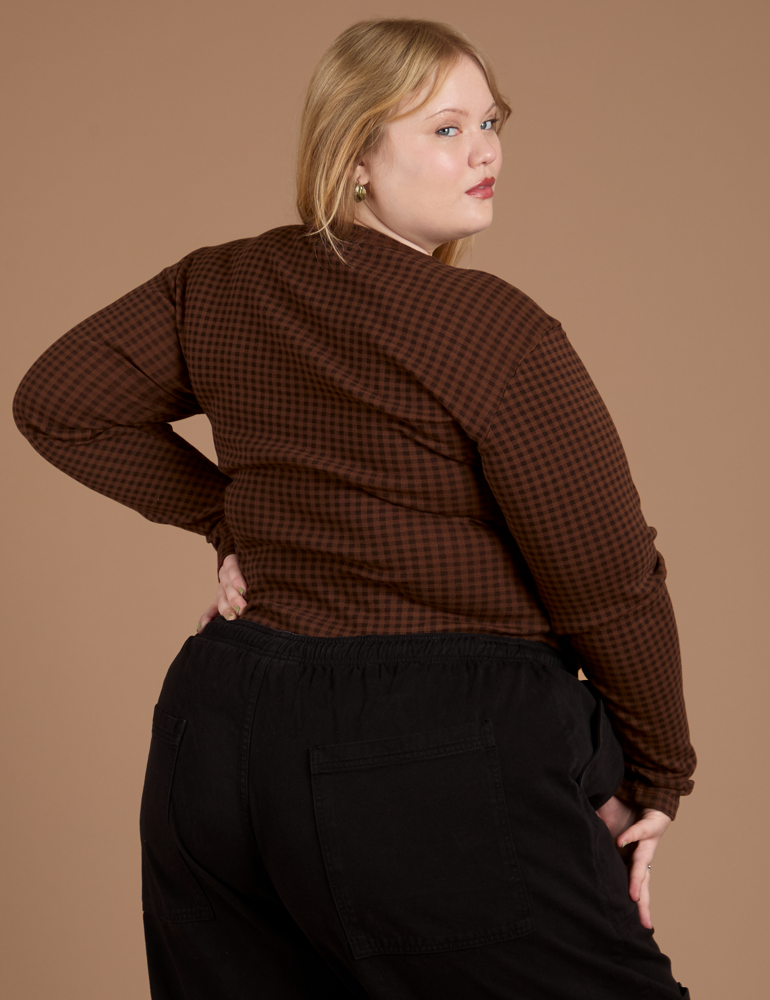 Long Sleeve Baby Tee in Fudgesicle Brown angled back view on Juliet