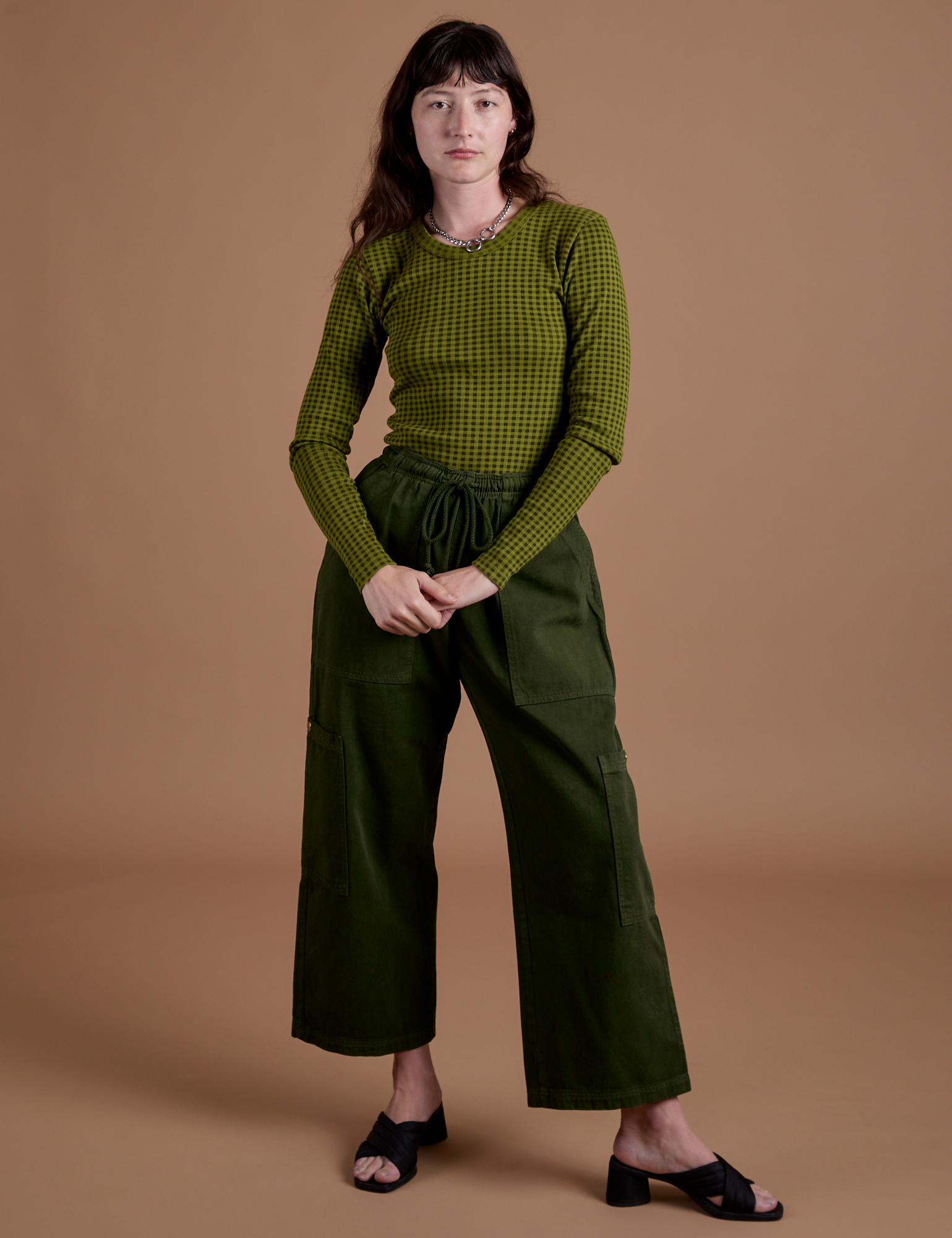 Gingham Long Sleeve Baby Tee in Summer Olive and evergreen Drop Pocket Cargo Pants worn by Alex