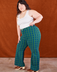 Side view of Gingham Western Pants in Green and Cropped Tank in vintage tee off-white