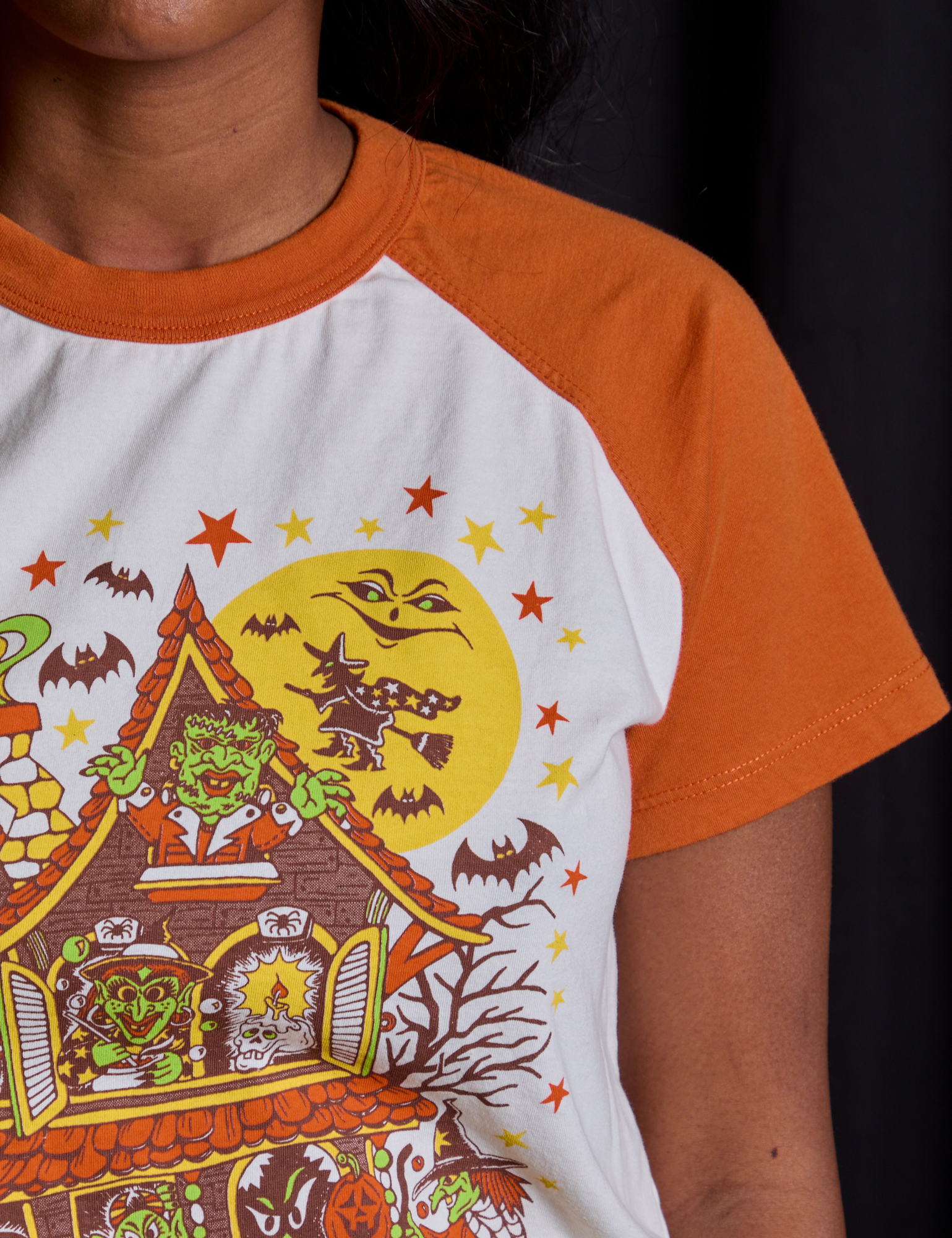Short Sleeve Raglan Tee in Haunted House sleeve close up on Kandia