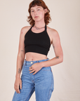 Alex is 5'8" and wearing P Halter Top in Basic Black and light wash Frontier Jeans