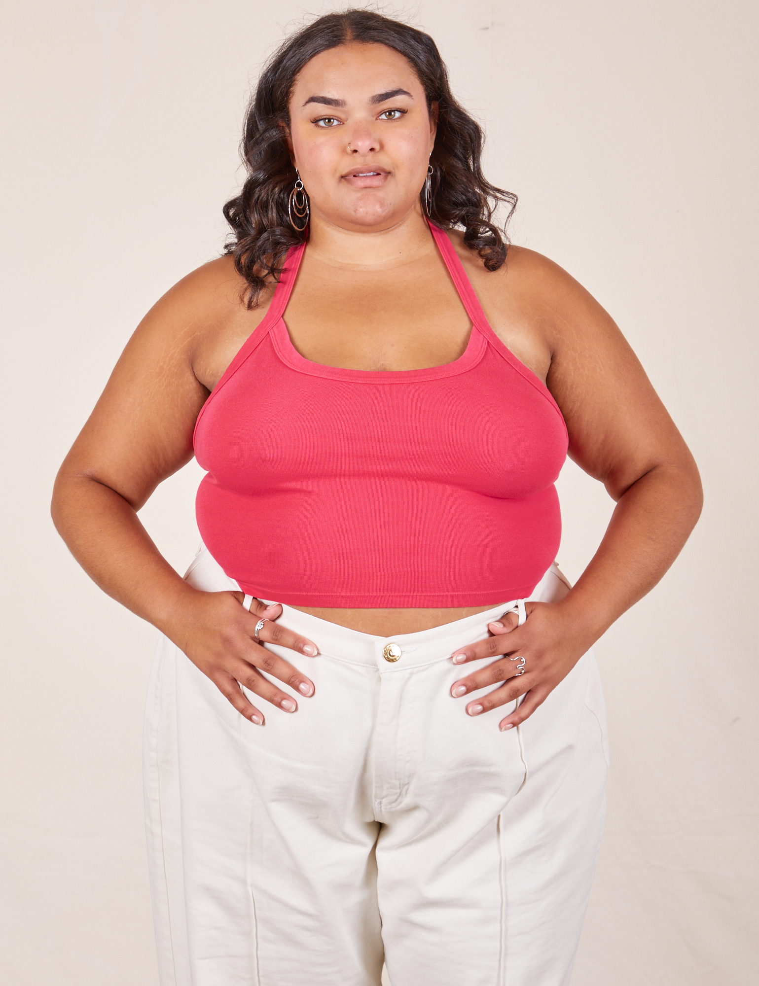Alicia is 5&#39;9&quot; and wearing XL Halter Top in Hot Pink paired with vintage off-white Western Pants