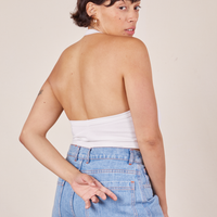 Back view of Halter Top in Vintage Off-White and light wash Sailor Jeans worn by Tiara