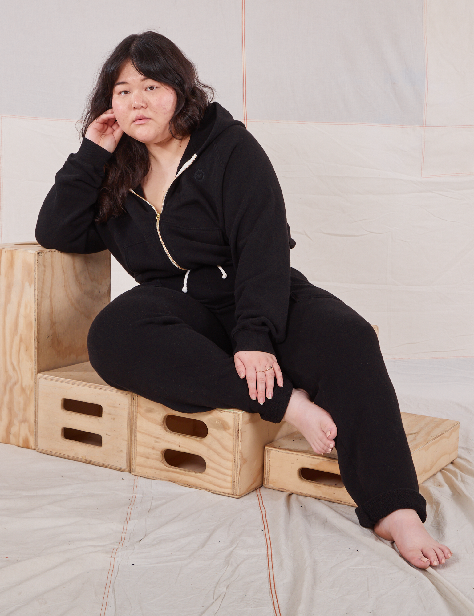 Ashley is wearing Rolled Cuff Sweat Pants in Basic Black and matching Cropped Zip Hoodie