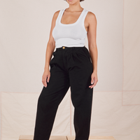 Tiara is 5'4" and wearing S Heavyweight Trousers in Basic Black paired with vintage off-white Cropped Tank Top.