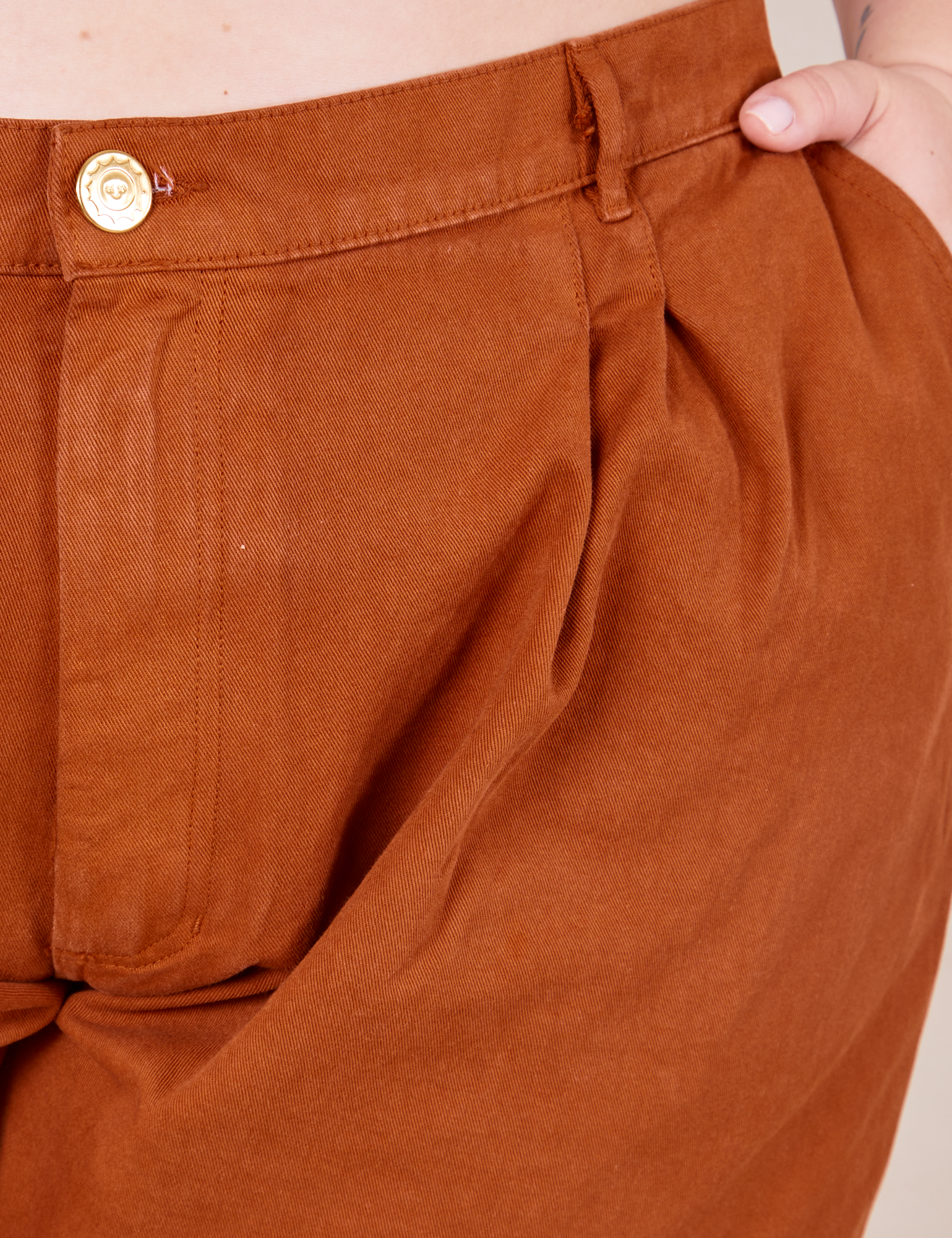 Front close up of Heavyweight Trousers in Burnt Terracotta worn by Ashley