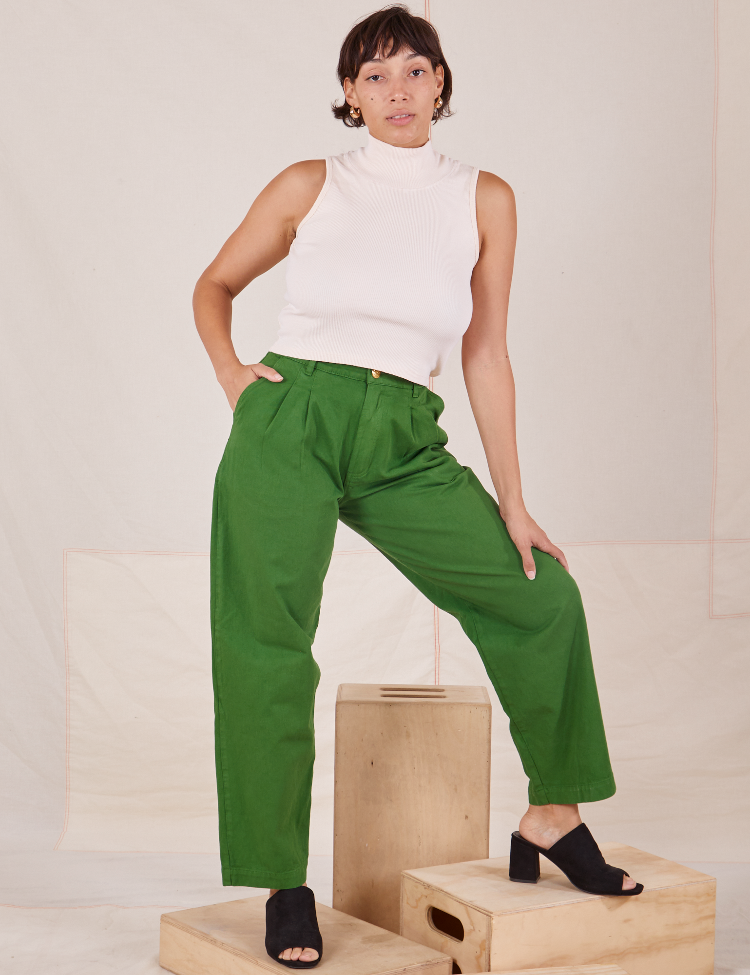 Tiara is 5&#39;4&quot; and wearing S Heavyweight Trousers in Lawn Green paired with vintage off-white Sleeveless Turtleneck