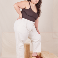 Side view of Heavyweight Trousers in Vintage Off-White and espresso brown Cropped Cami worn by Ashley.